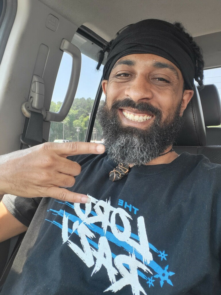 The Lord Razu community wearing archive merch